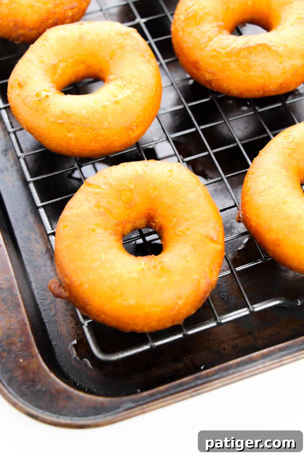 Choco-Biscuit Bliss Bites 5 Golden brown fried doughnuts on wire rack