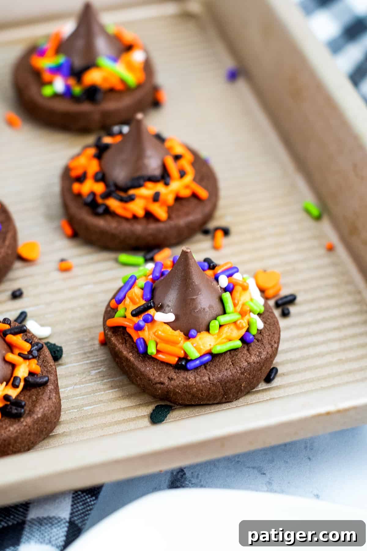 Chocolate witch hat cookies made with chocolate cookies and Hershey kisses