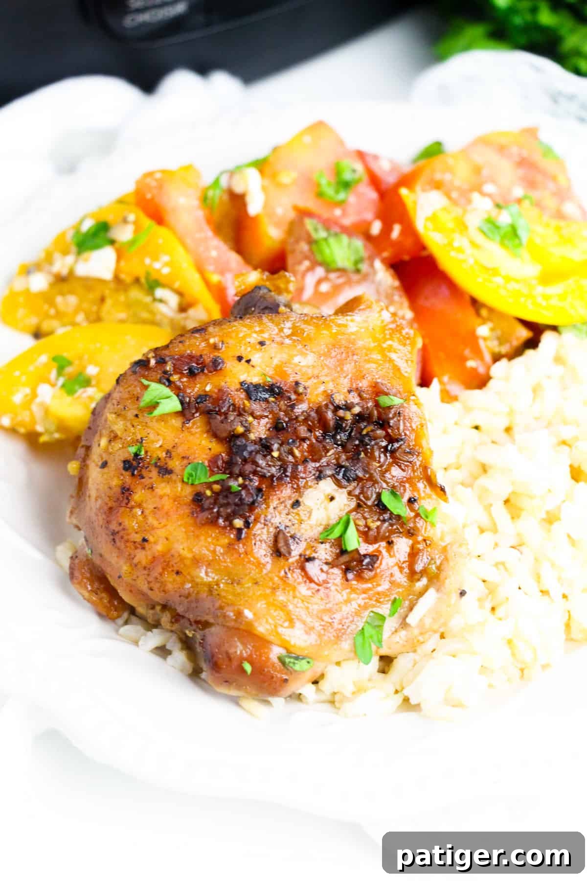 Garlic Brown Sugar Chicken Thigh with rice and tomato salad