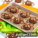 Chocolate rice krispies spider treats with pretzel legs and candy eyes