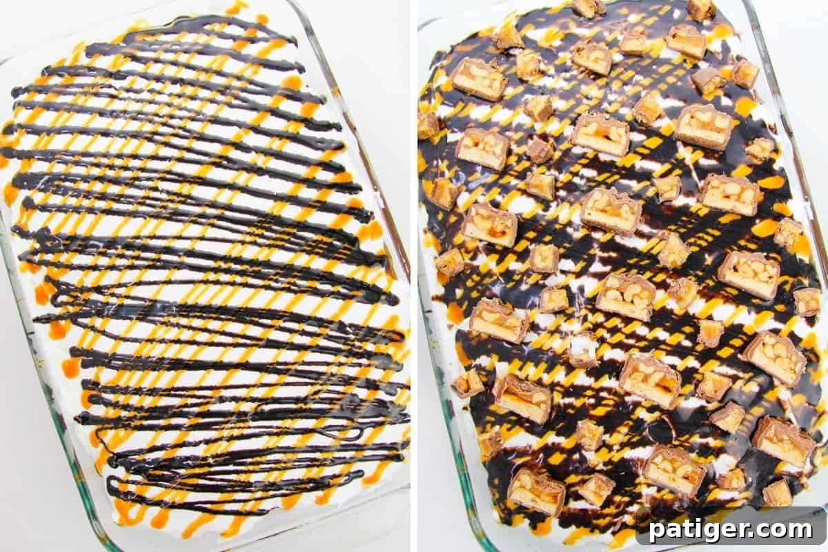 Chocolate cake with cool whip topping and caramel and chocolate sauce drizzles on top with large chunks of Sinckers bars, ready to serve.