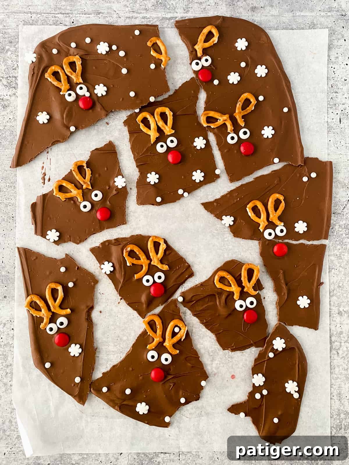Reindeer Chocolate Christmas Bark broken into pieces on parchment paper