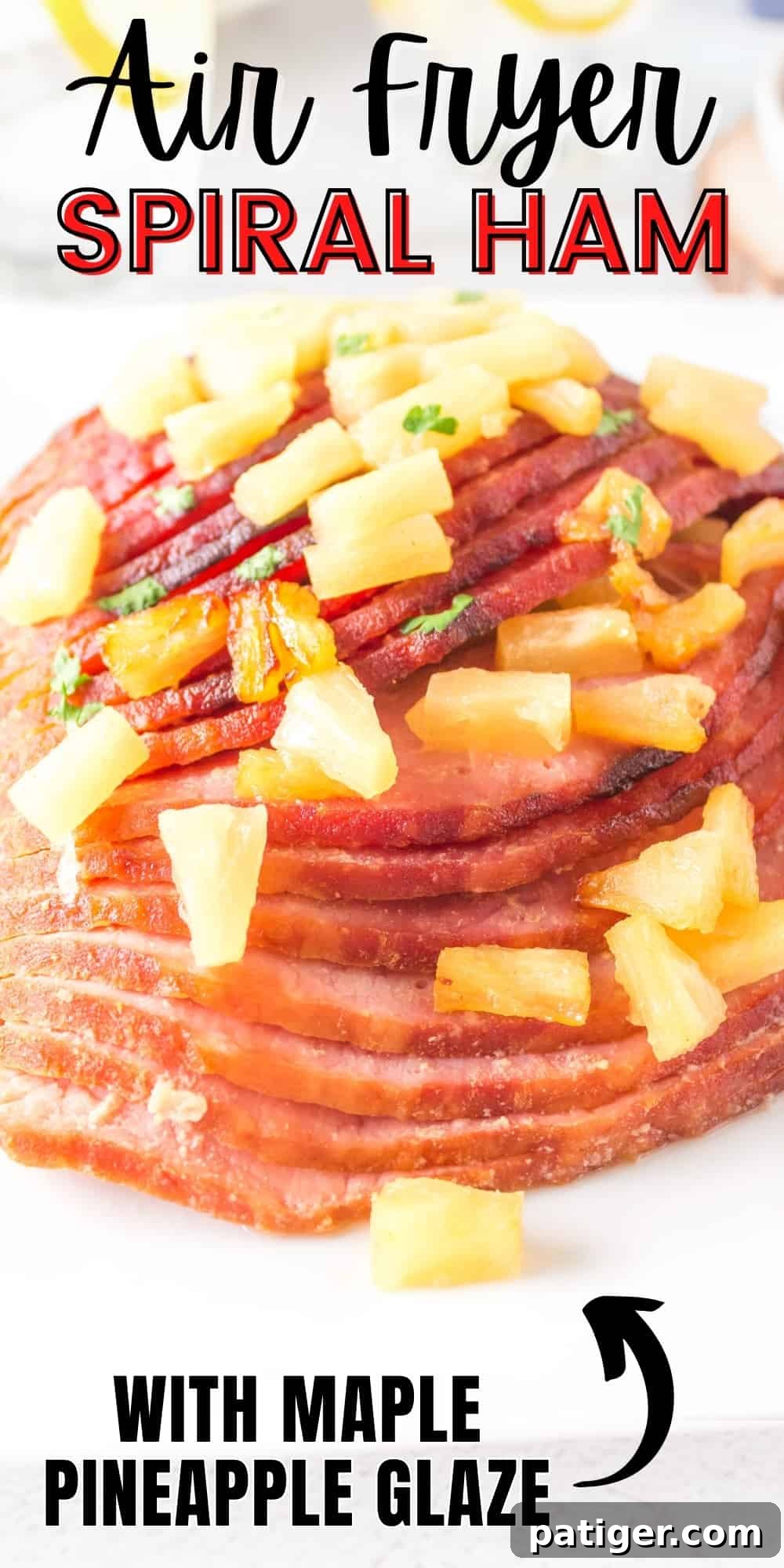 Delicious Air Fryer Spiral Ham with Maple Pineapple Glaze, perfect for any holiday or family dinner, showcasing its golden brown finish and sweet-tangy sauce.