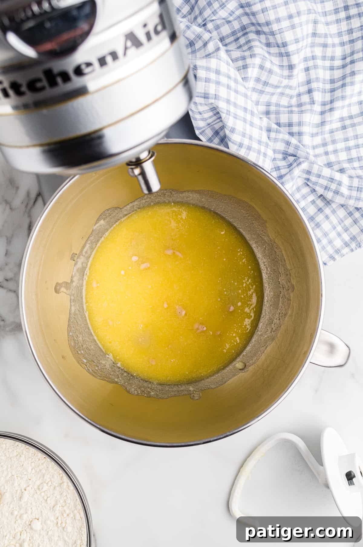 Wet ingredients mixed with dough hook in mixer