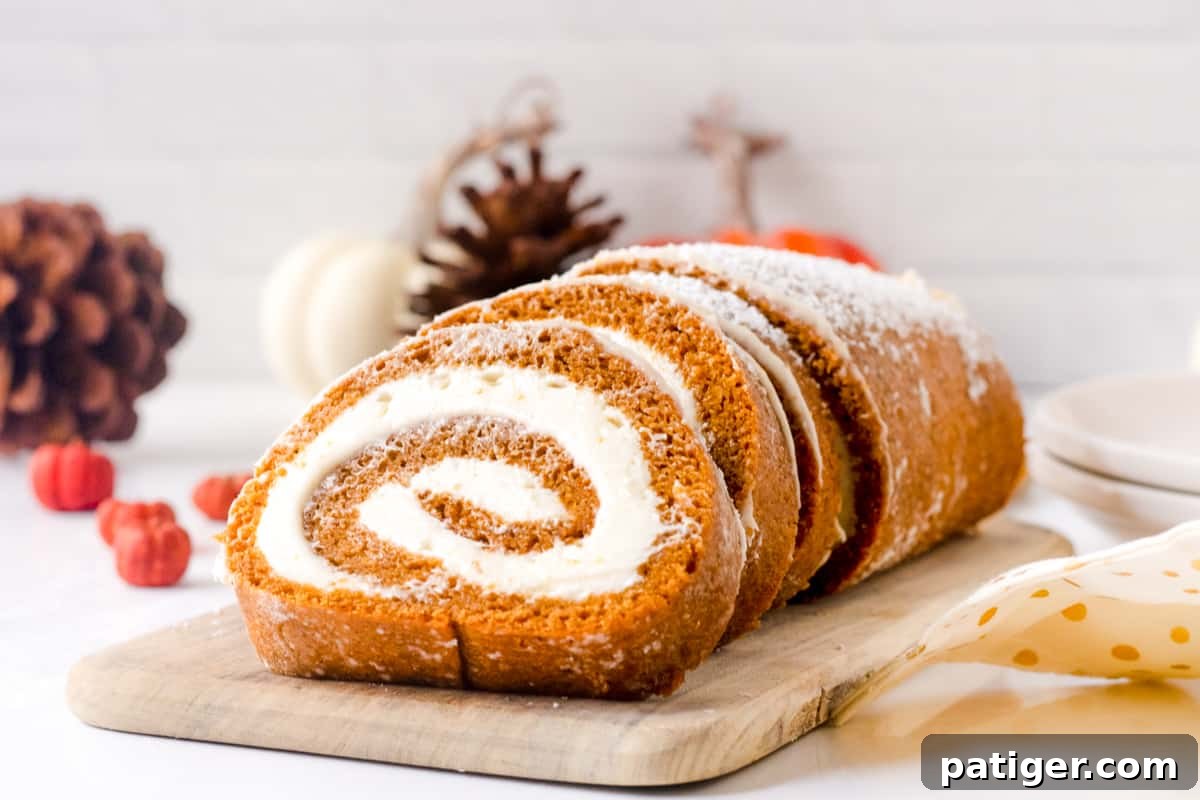 Spiced Pumpkin Swirl Cake 13 A perfectly sliced pumpkin roll with a distinct swirl of cream cheese filling, lightly dusted with powdered sugar.
