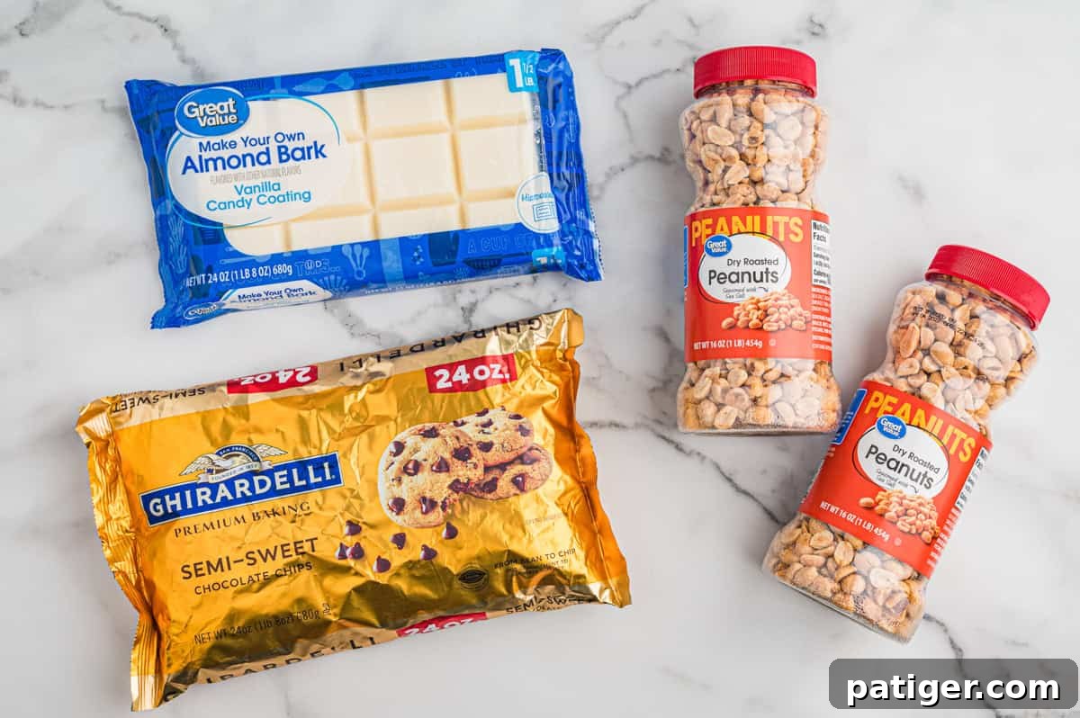 Ingredients for crock pot candy on marble surface, including dry roasted peanuts, semi-sweet chocolate chips, and almond bark.