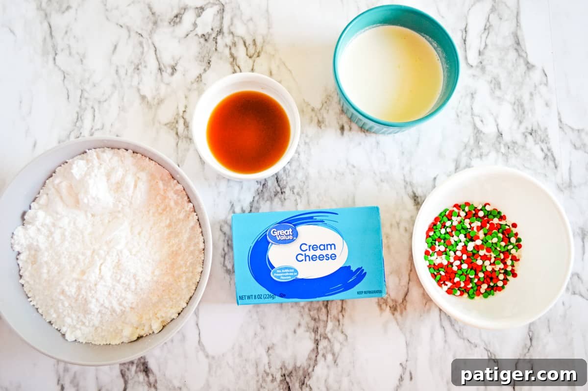 Individual bowls holding key ingredients for Christmas cookie dip: powdered sugar, vanilla extract, heavy whipping cream, Christmas sprinkles, and a block of Great Value cream cheese, all laid out on a kitchen counter.