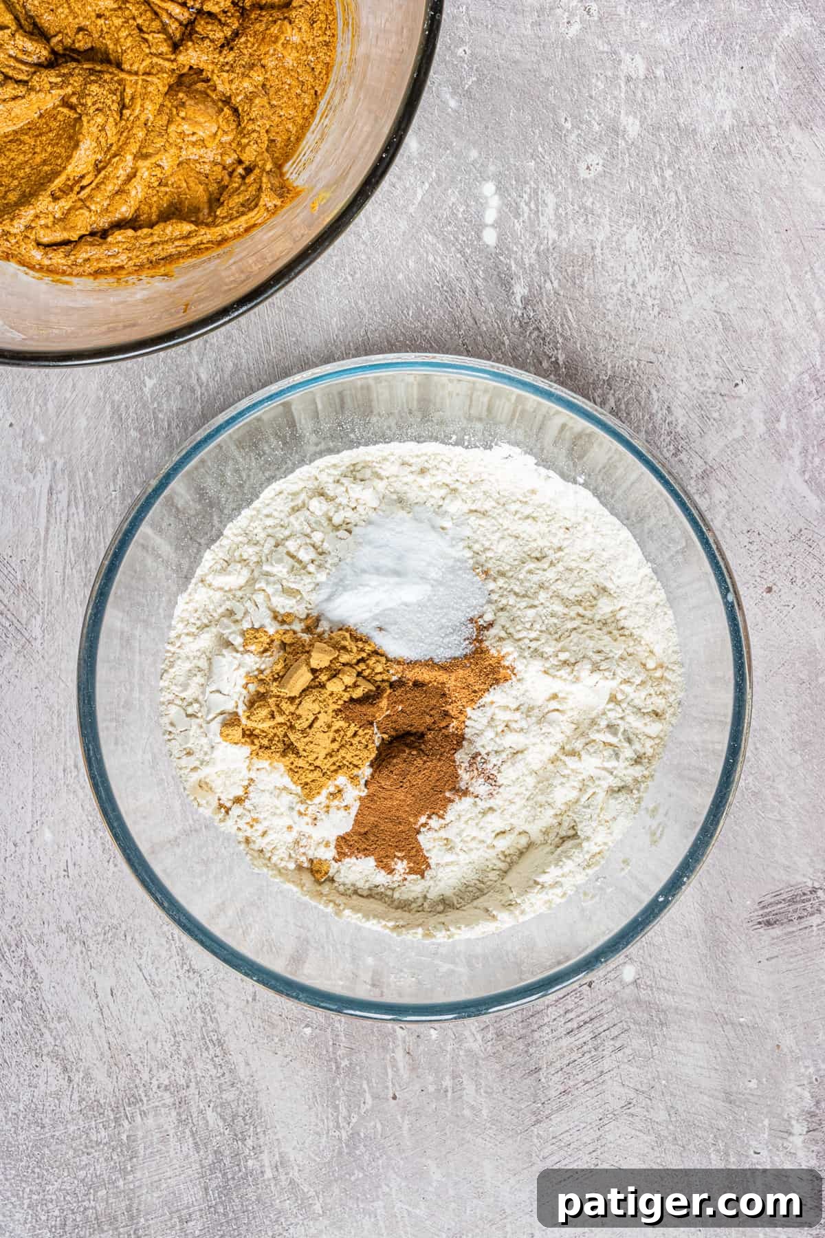 flour, salt, and spices in glass mixing bowl