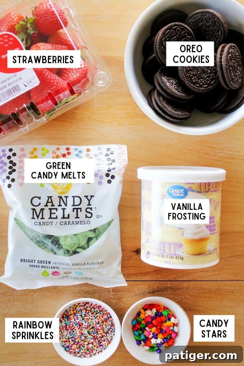 pound of strawberries, bowl of OREO cookies, bag of bright green candy melts, container of vanilla frosting, bowl of rainbow sprinkles, and bowl of candy stars