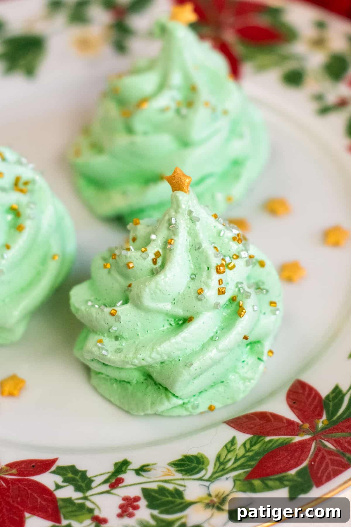 Christmas Tree Meringue Cookies decorated with gold star and sprinkles
