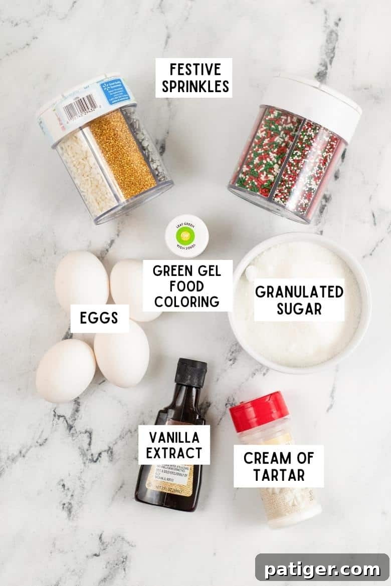 Festive sprinkles, bowl of granulated sugar, 4 eggs, bottle of vanilla extract, cream of tartar, and bottle of green gel food coloring on countertop