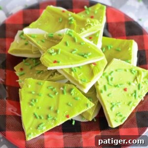 Christmas Grinch Bark Candy with green sprinkles and red hearts