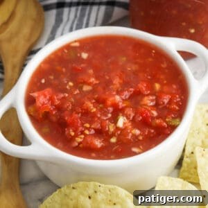 Rotel salsa dip served with tortilla chips, inviting a delicious homemade snack.