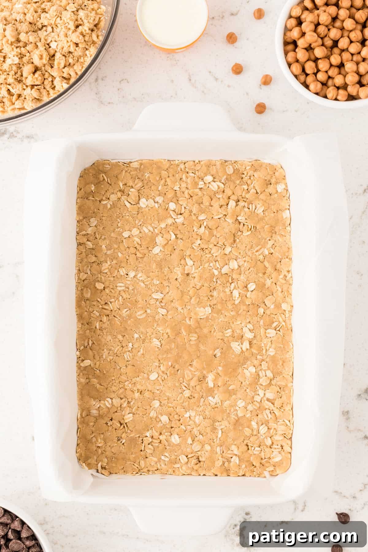 Oatmeal cookie crust pressed into the bottom of 9 x 13 pan before baking
