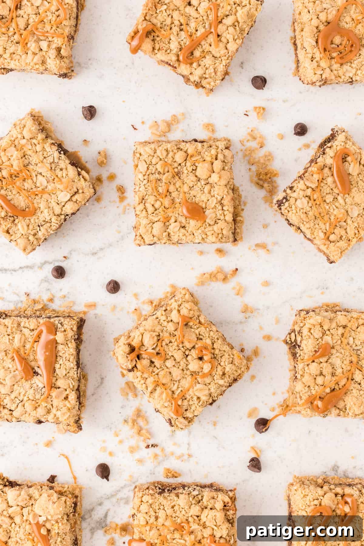 Carmelitas cookie bars sliced into squares and topped with a drizzle of caramel