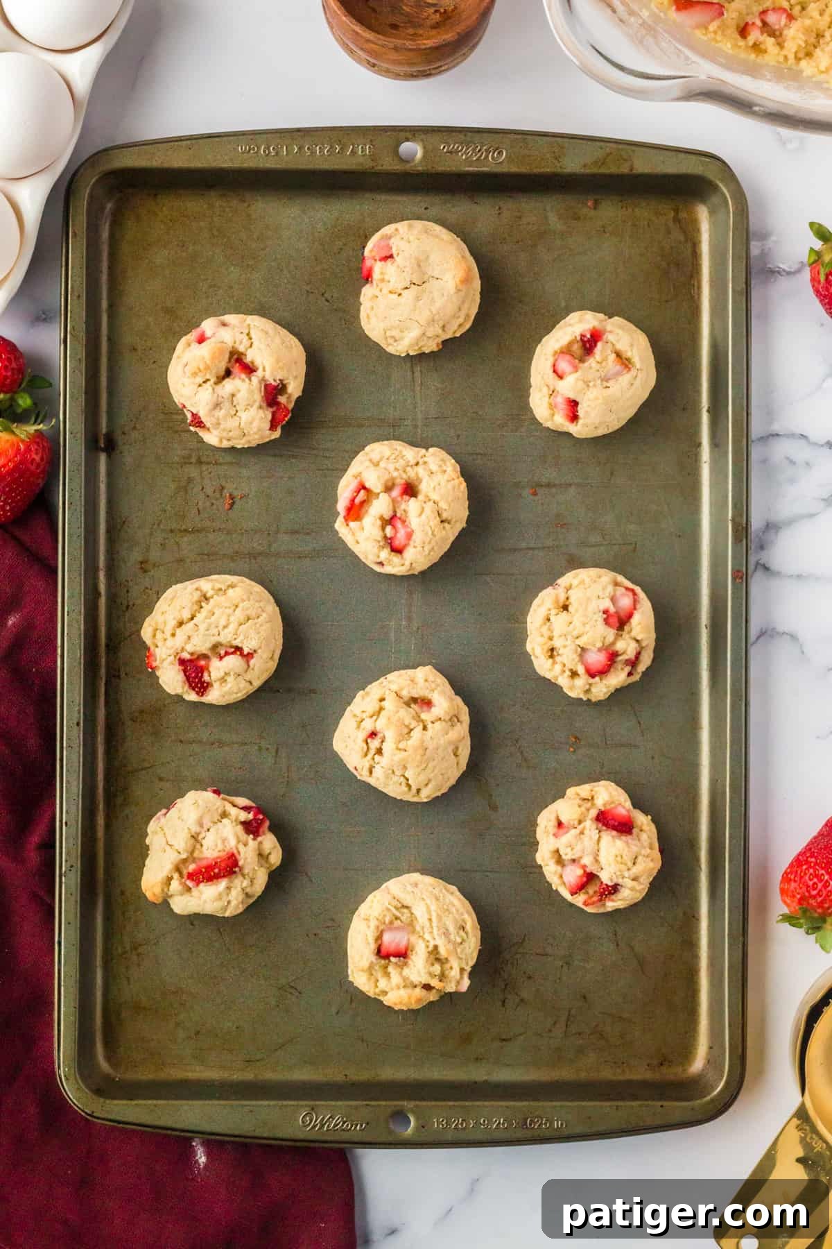 Strawberry Shortcake Cookie Bliss 11 Freshly baked strawberry shortcake cookies on baking sheet