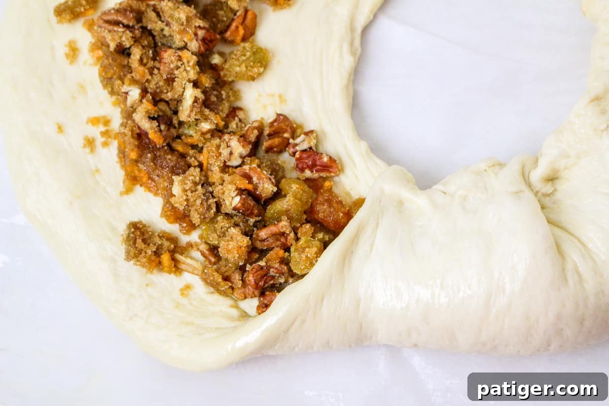 The dough is pulled up over the filing and to the center, where it is pinched close.