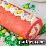 Easter cake roll with whipped cream filling and mini eggs.