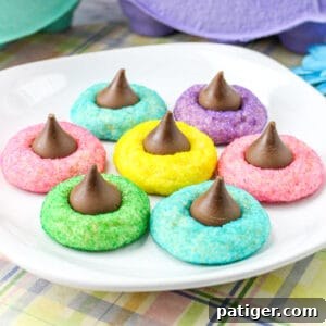Colorful Easter Blossom Cookies with Hershey Kisses on a white plate, beautifully presented.