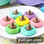 Colorful Easter Blossom Cookies with Hershey Kisses on a white plate, ready for sharing on social media.