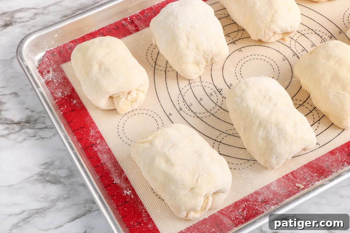 Reuben Pinwheels 7 Unbaked rolls on lined baking sheet.
