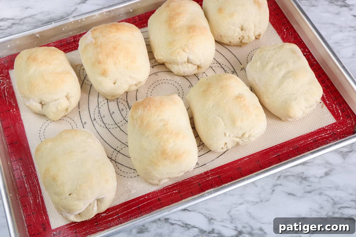 Reuben Pinwheels 8 Eight corned beef Reuben pizza roll ups on line baking sheet.