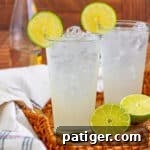 Ranch water cocktails on straw tray with lime garnish.