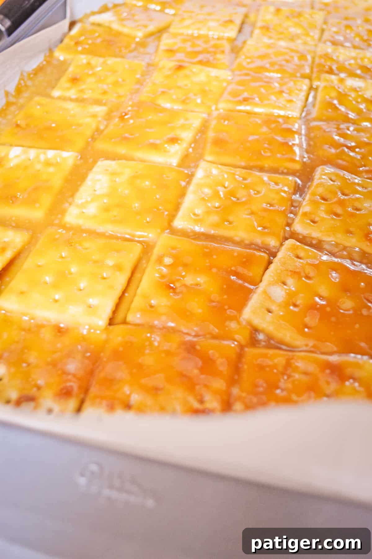 Saline cracker toffee on baking sheet before adding chocolate.