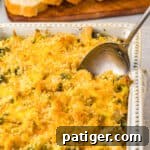 Chicken Divan in white casserole dish topped with panko breadcrumbs and melted cheese.