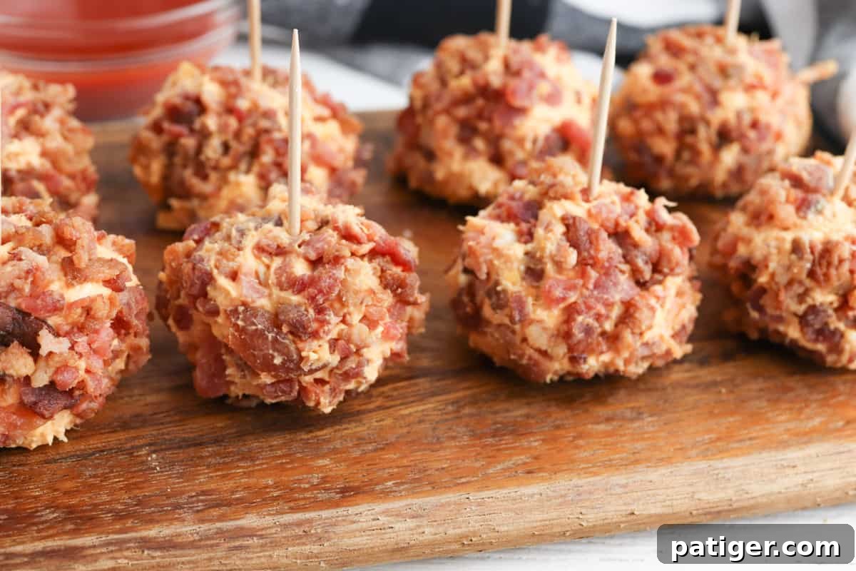 Mini buffalo chicken cheese balls with toothpicks in each one, arranged for serving.