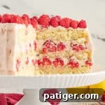 Lemon raspberry cake with three layers of yellow cake and a raspberry filling and frosting.