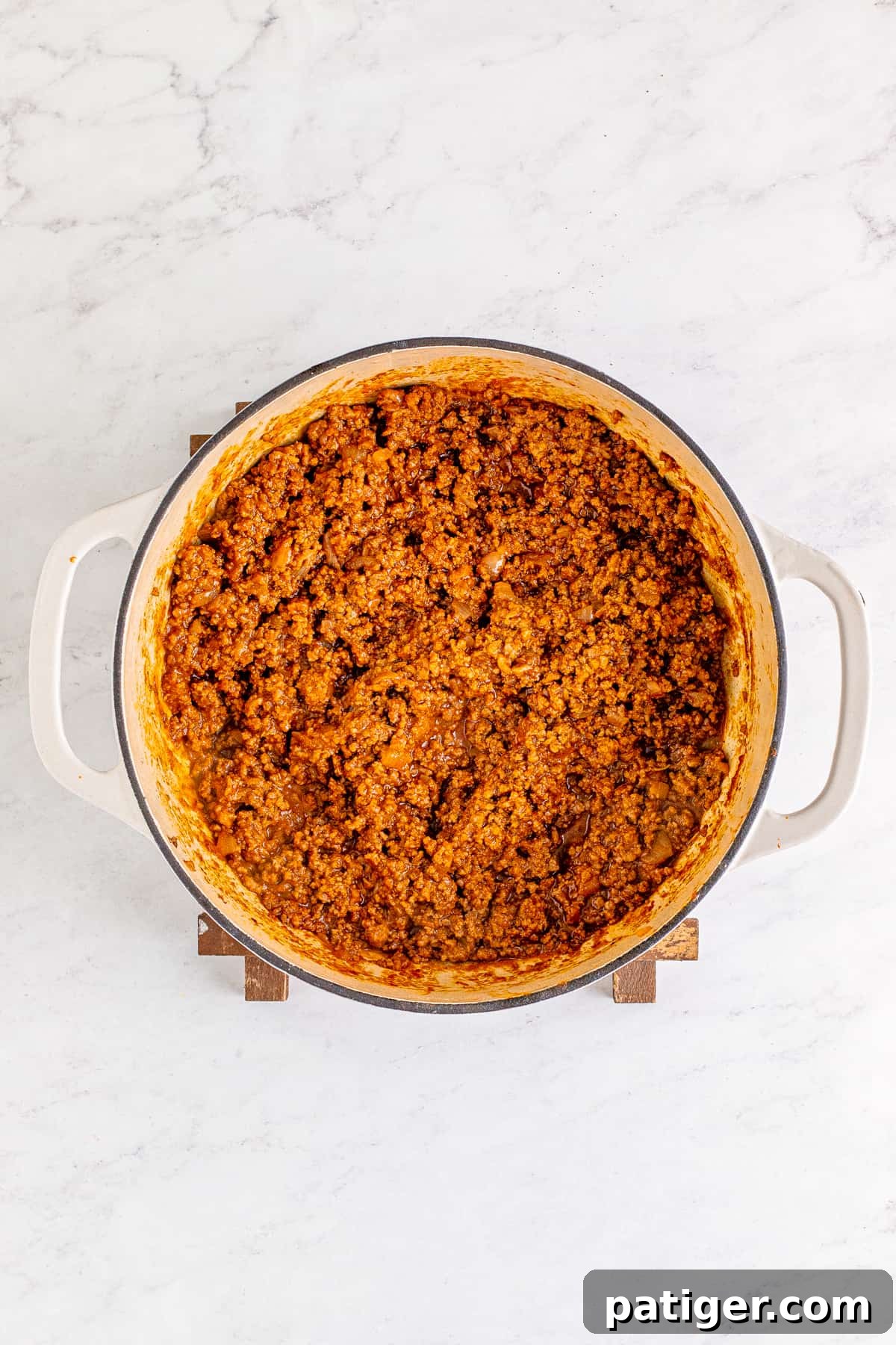 Homemade hot dog chili in a dutch oven.