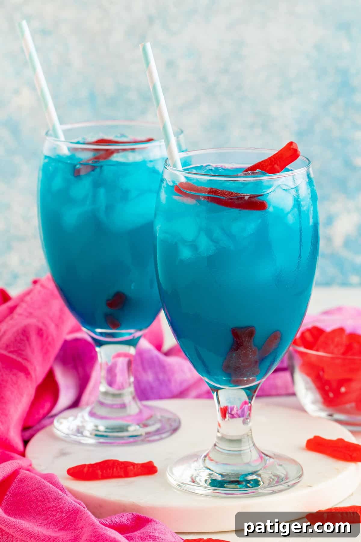 Two ocean water cocktail drinks.