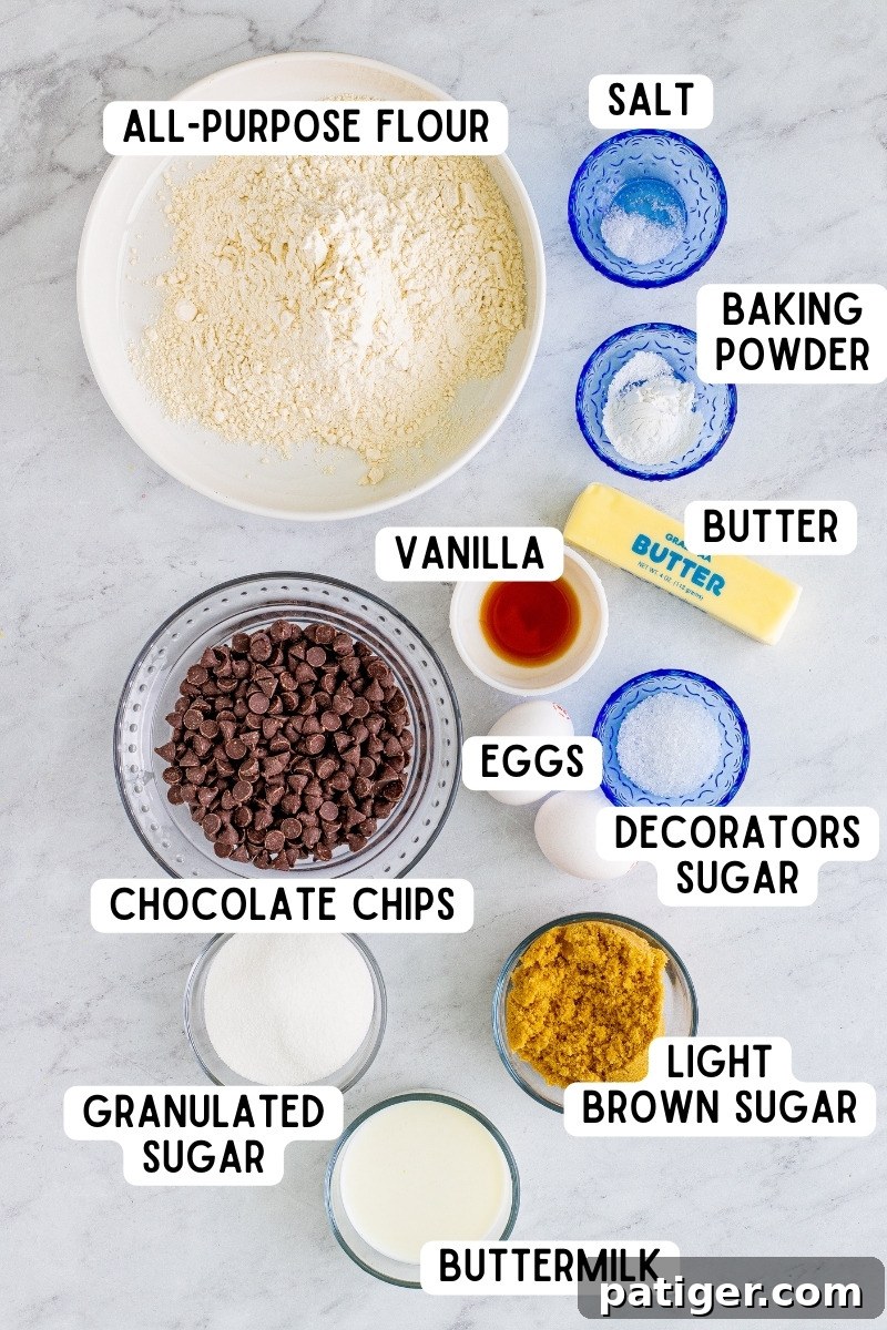 Ultimate Bakery Chocolate Chip Muffins 4 Various ingredients for chocolate chip muffins, including flour, sugar, butter, and chocolate chips, neatly arranged in bowls on a kitchen countertop.