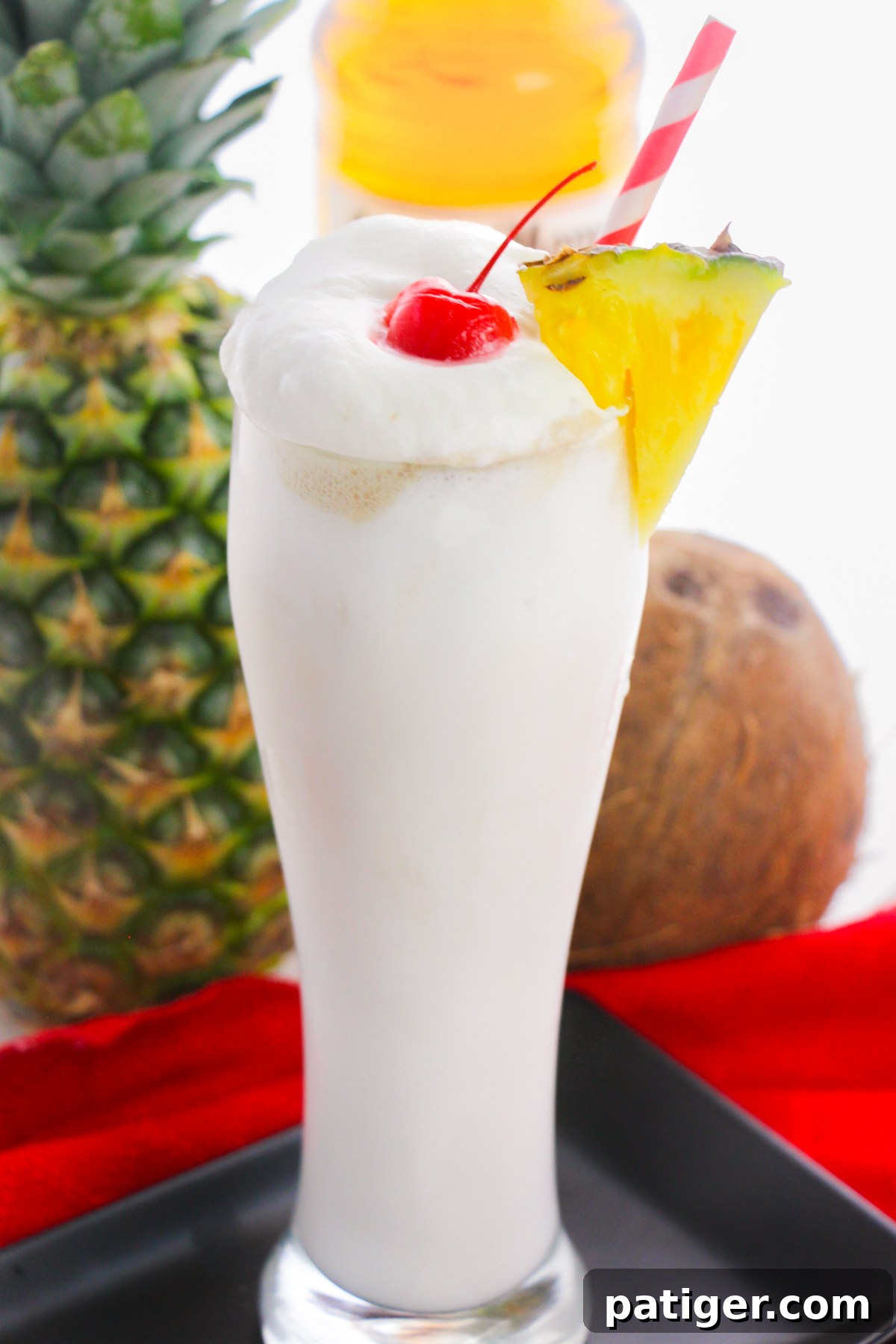 Frosty Island Escape 2 Creamy frozen pina colada with whipped cream, pineapple, and cherry.
