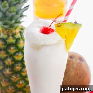 Frosty Island Escape 8 Frozen pina colada with whipped cream, pineapple, and cherry.