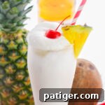 Frosty Island Escape 9 Frozen pina colada with whipped cream, pineapple, and cherry.