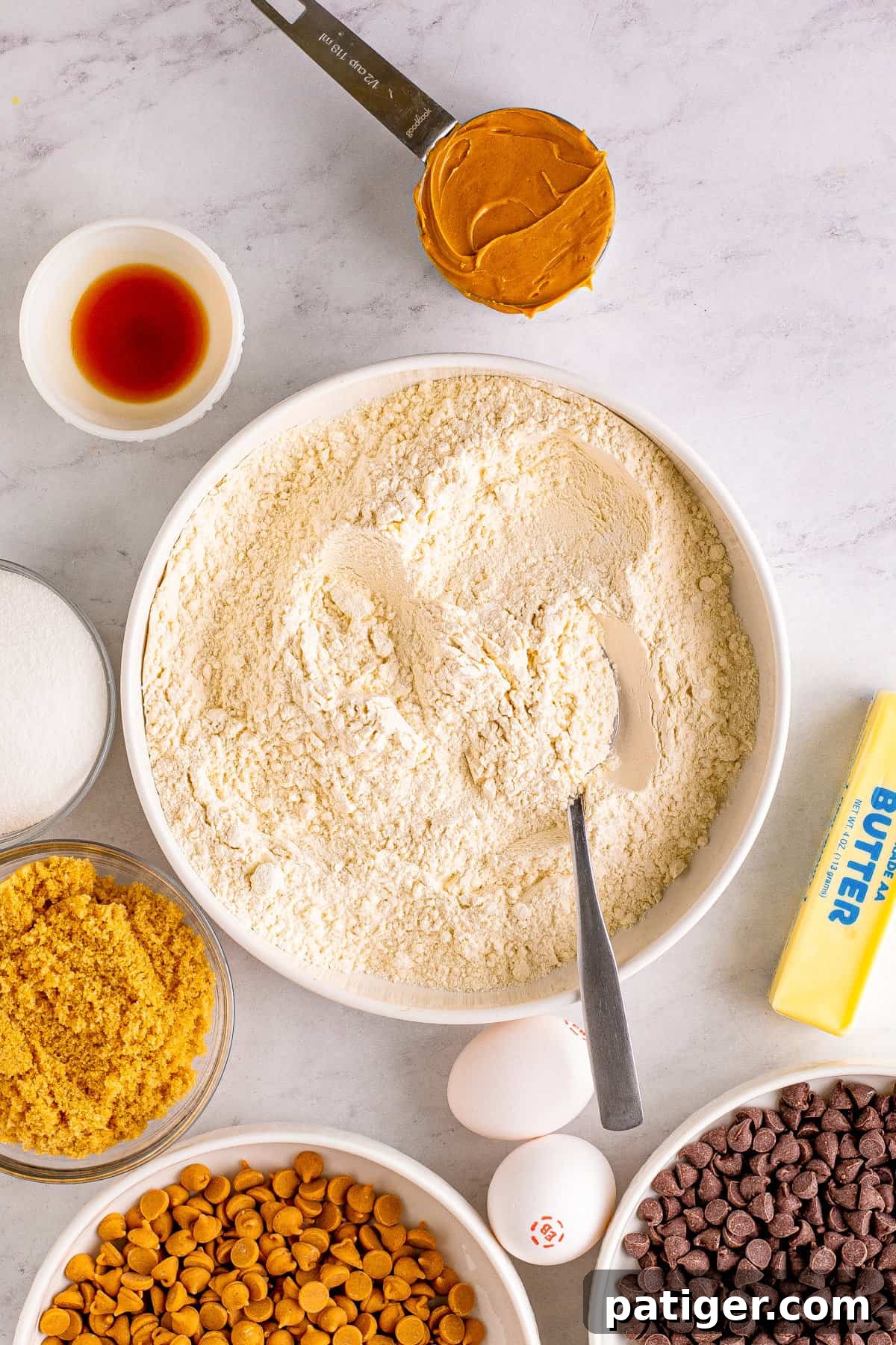 Peanut Butter Chocolate Chip Indulgence Bars 5 Bowl of dry ingredients with spoon.