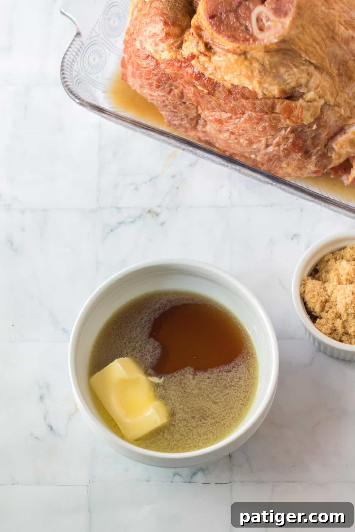 Small bowl containing melted butter and maple syrup, forming the initial glaze.