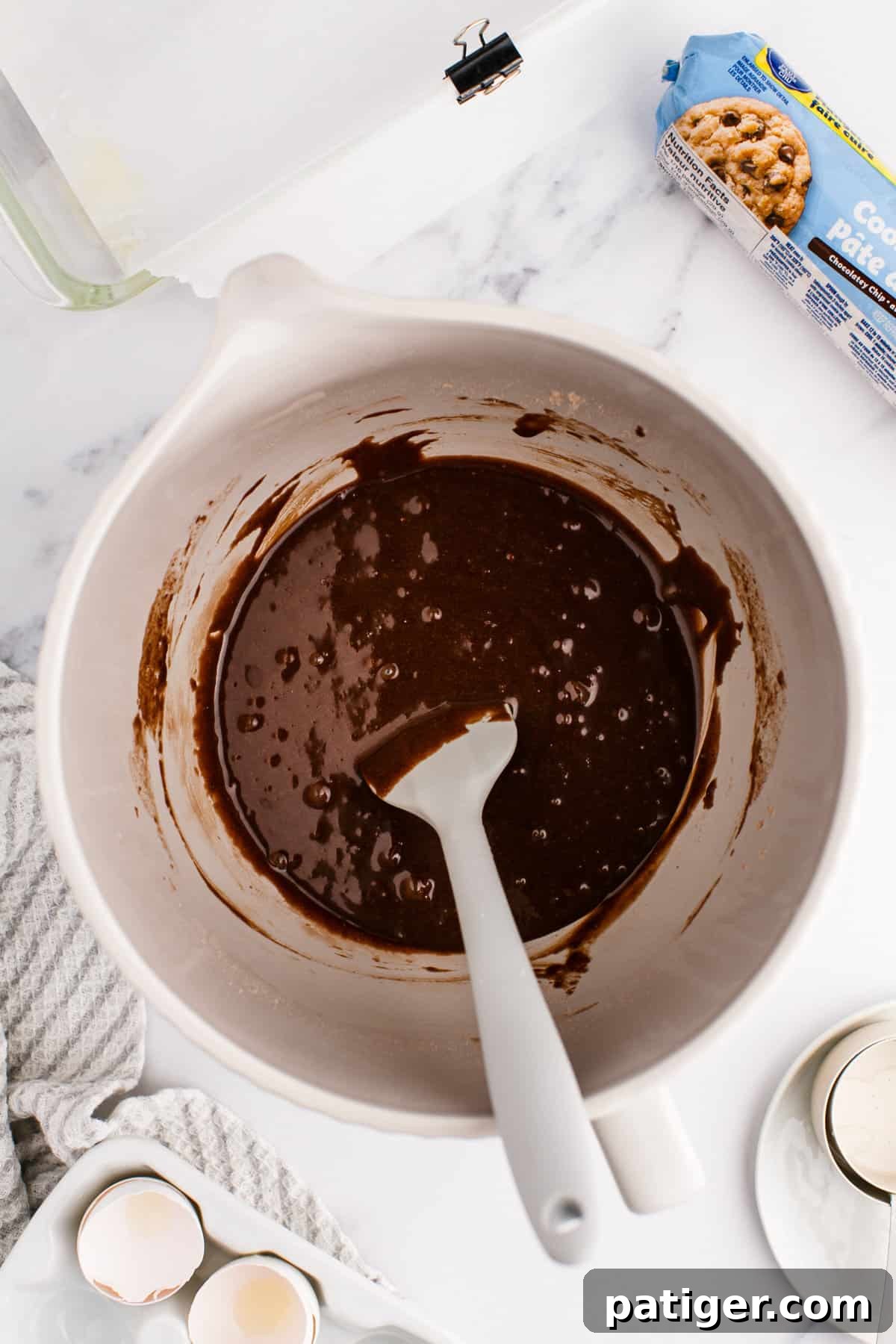 Rich, chocolatey brownie batter in a large mixing bowl, ready for the baking pan.