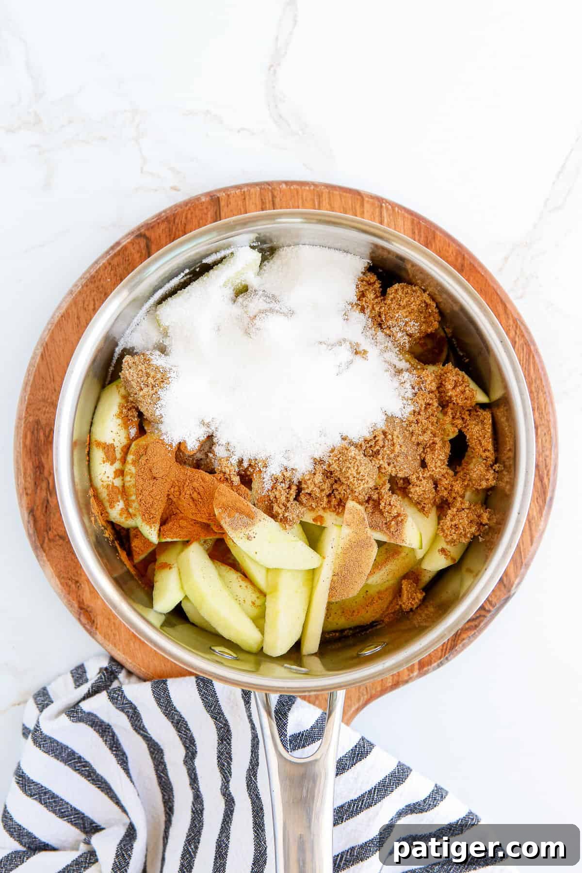 Ingredients for homemade apple pie filling in pot.