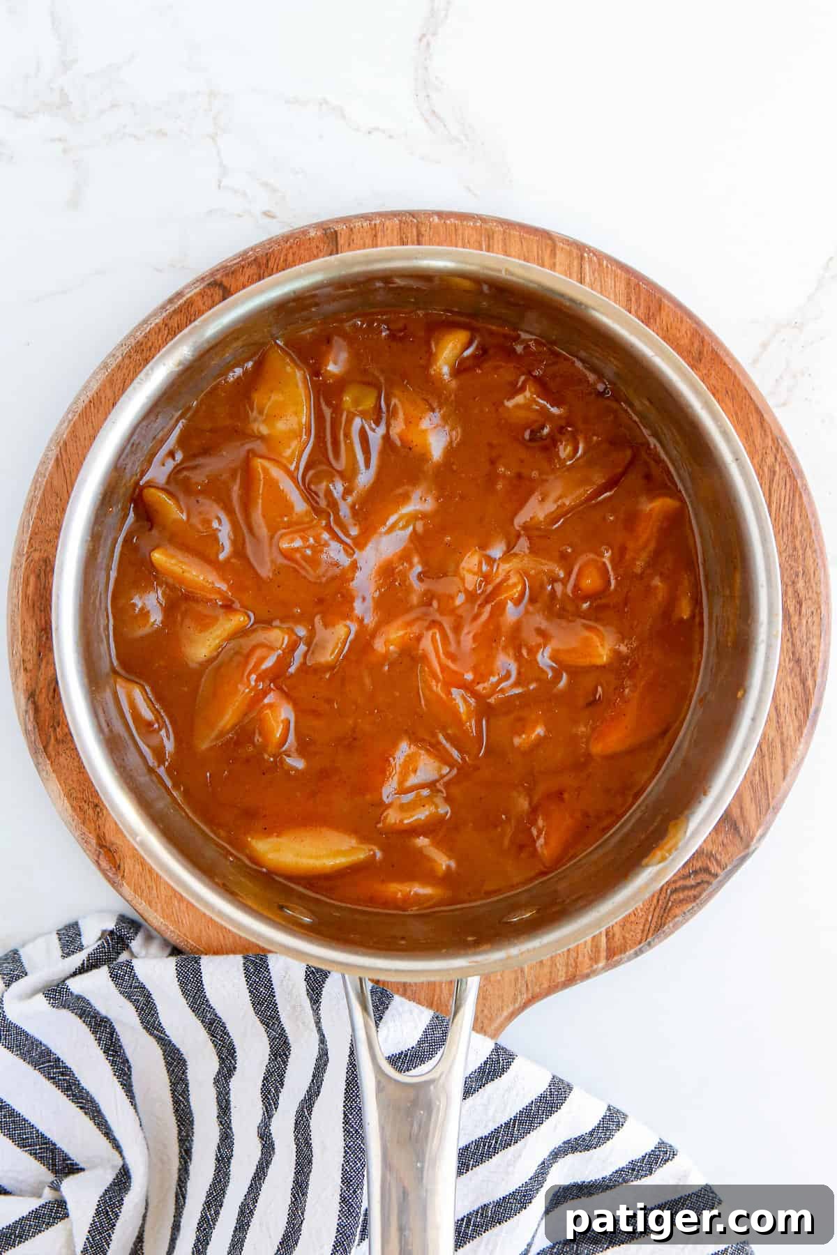 Homemade apple pie filling in pot.