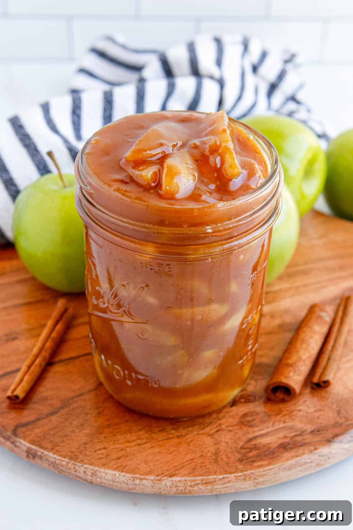 Homemade apple pie filling in mason jar without lid.