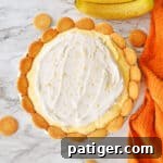 No-Bake Banana Pudding Pie with Cool Whip and Nilla wafers on top.