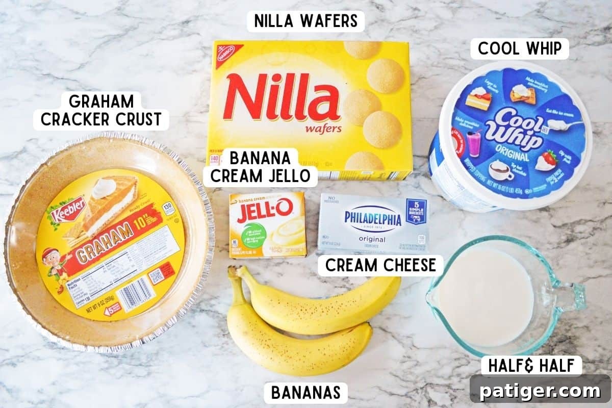 Collection of ingredients for banana pudding pie, including Nilla wafers, graham cracker crust, banana cream pudding mix, Cool Whip, half and half, cream cheese, and fresh bananas.