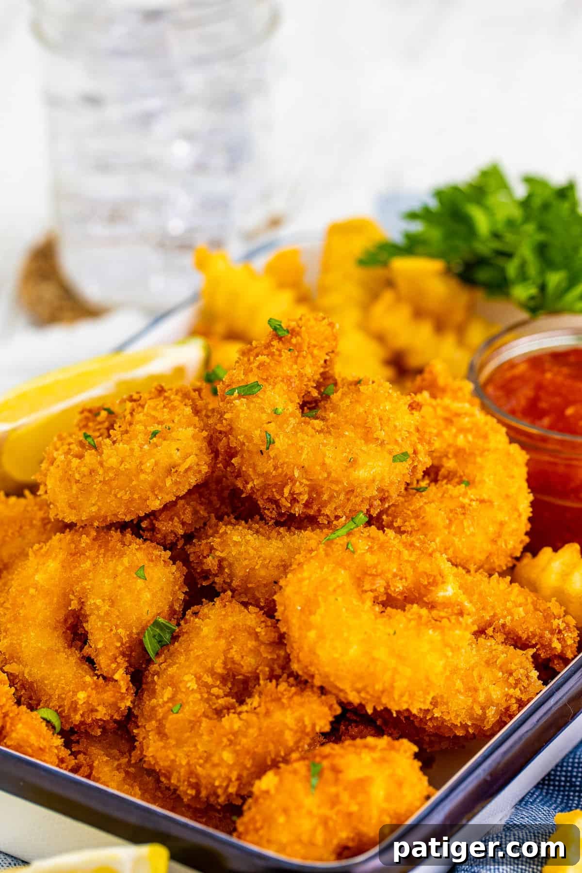 Beautifully fried panko shrimp garnished with fresh parsley, ready to be served.