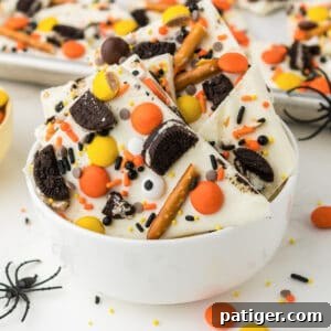 Halloween Bark Recipe with pretzels, oreos, and halloween candy.,