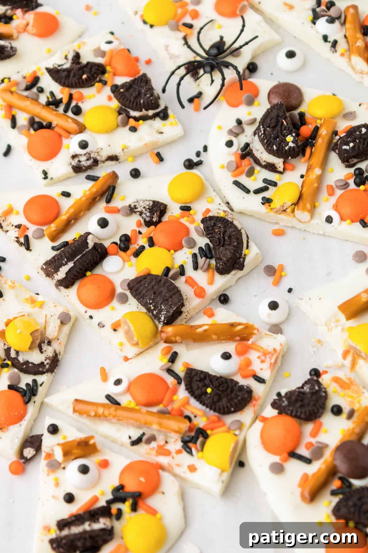 Pieces of sweet and salty halloween bark on white background.