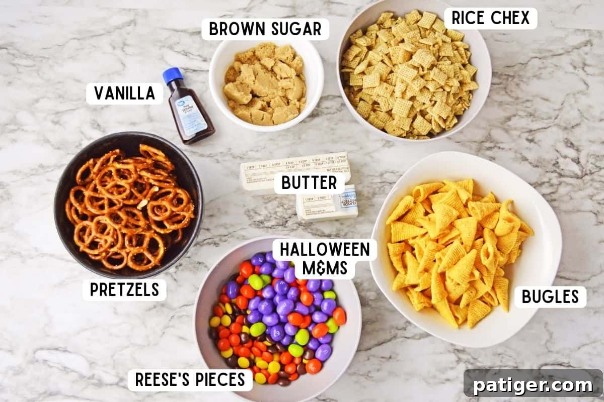 Monster Mash Snack Mix 4 Halloween chex mix ingredients including mini pretzel twists, bugles, chex, M&Ms, vanilla extract, Reese's Pieces, and butter.