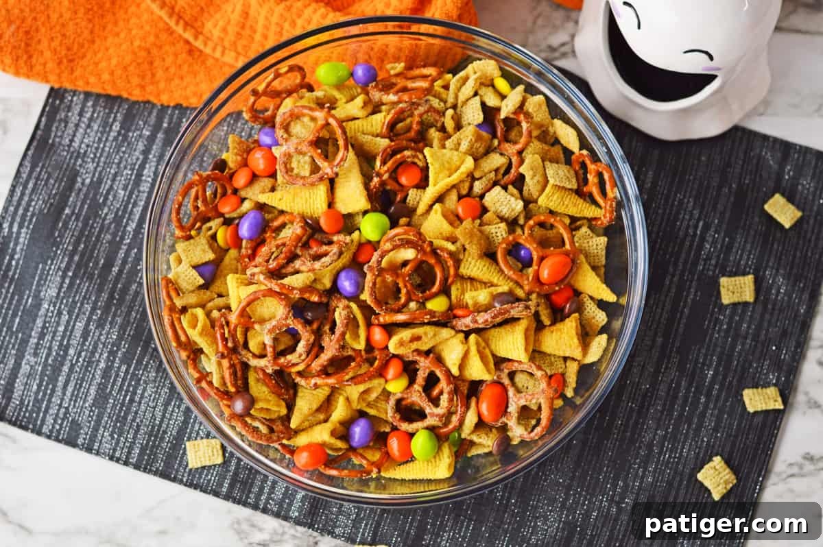 Monster Mash Snack Mix 7 Halloween snack mix in a large glass bowl.